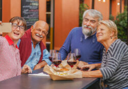 Elderly people take a selfie at the table - Mature couple have fun at the restaurant - Senior concept